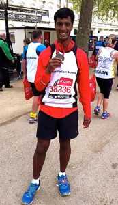 DLS London Marathon runner showing off his medal post-race.